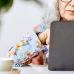 An older woman on her laptop